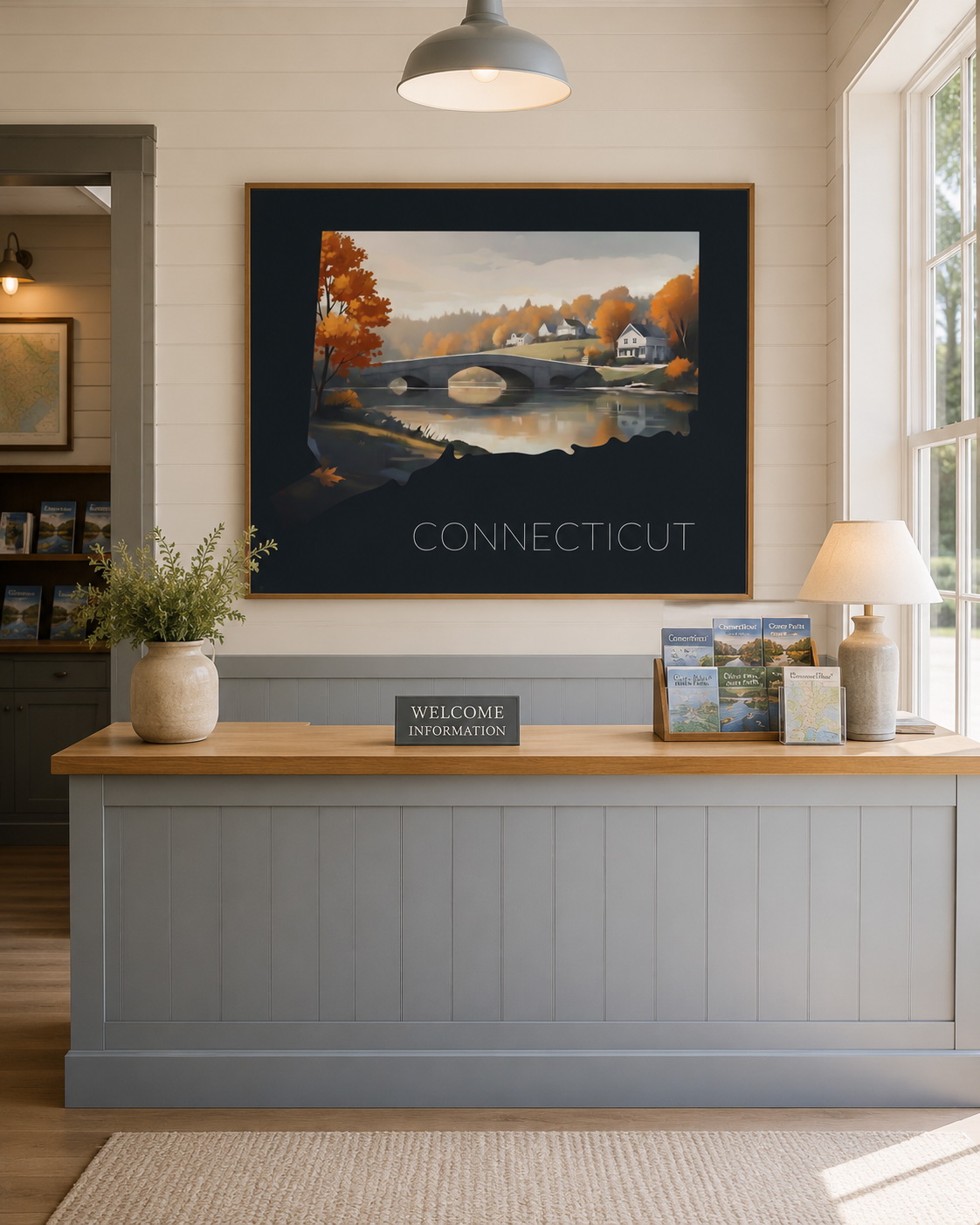 Connecticut state artwork displayed in a visitor information center with regional brochures