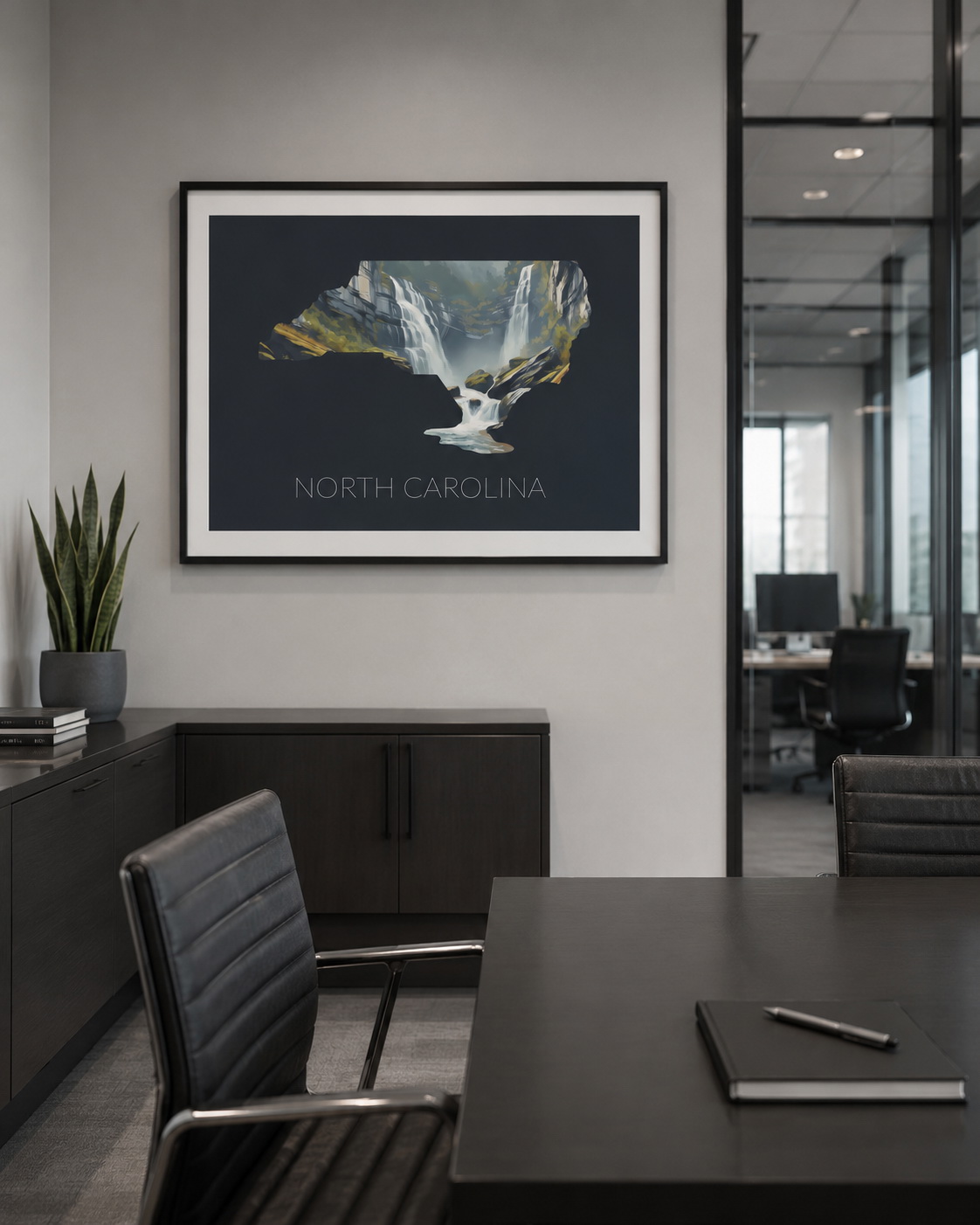 North Carolina state artwork featured on gift shop merchandise including framed art, mug, notebook and apparel