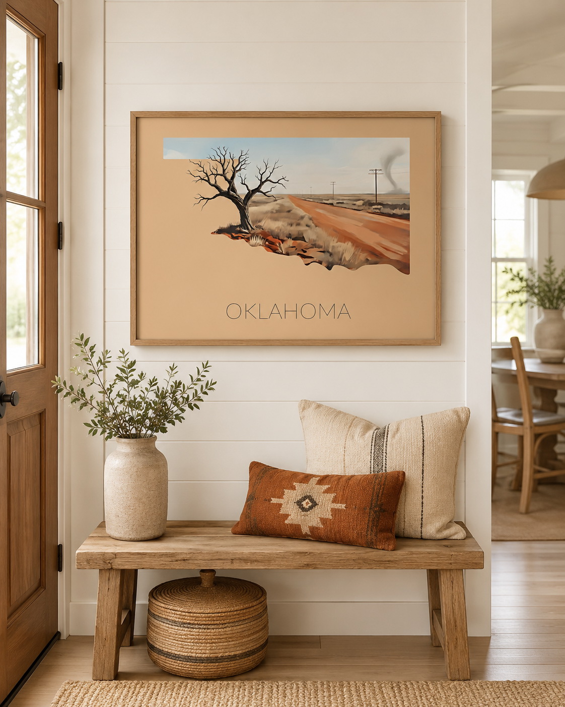Oklahoma state artwork displayed as framed wall art in a warm rustic home entryway